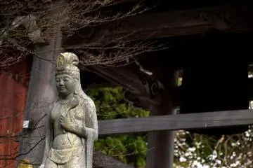 <p>Kannon statue standing beside the belfry (Kannon means Goddess of Mercy).</p>