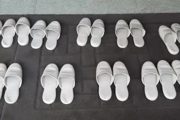 Shoes off at the entrance to the museum building