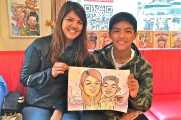 <p>My son and I holding our finished caricature. What do you think?</p>