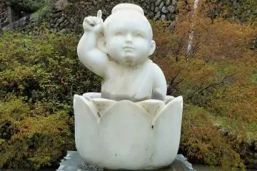 <p>This is Buddha as an infant. Although best visited as a quick stop by car, the temple is accessible by mass transportation. It sits along four bus routes originating at Hanno Station. Get off at Taki Fudoson.</p>