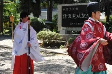 Priest and priestess come to collect the bride and groom for a traditional wedding