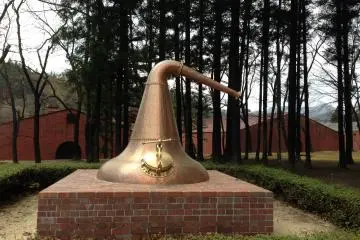 <p>A sculpture of the copper vat is prominently displayed near the visitor's entrance</p>