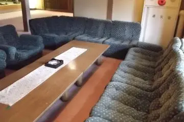 <p>The couches to lounge on near reception</p>
