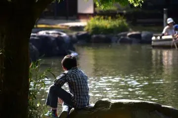<p>A boy on a rock deep in thought?!</p>
