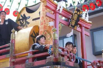 Children ride on top of the floats