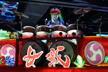 <p>The drummers pass by on large parade-like floats that seem to be controlled remotely&nbsp;</p>