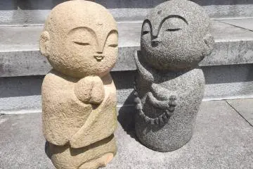 <p>Hanging out on the steps in front of the temple building</p>