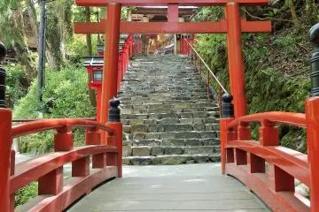 <p>There are two entrances to the main shrine, this back one crosses a tiny stream above which sits a small waterfall.</p>
