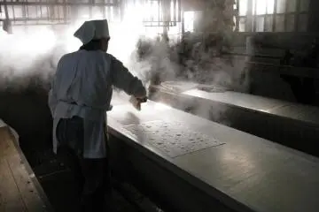 A hand broom is used to iron out any problems.