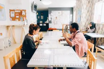 <p>The dining room is spacious and open. It's directly connected to the kitchen and the common area.</p>
