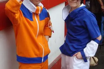 Cosplayers pose before the parade.  Uzumaki Naruto and Uchiha Sasuke from Naruto.
