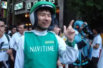 Not just for the young!  An older gentleman gets in on the fun as the cell phone navigation Navitime mascot