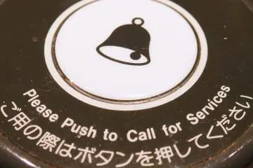 <p>Each table is given a "call button" which alerts a waitress when you are ready to order</p>
