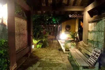 <p>The exterior is atmospherically lit at night</p>