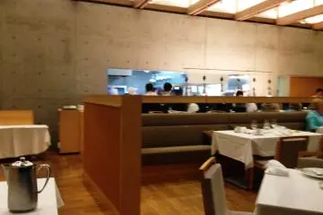 The calming walls are a counterpoint to the action inside the open kitchen.