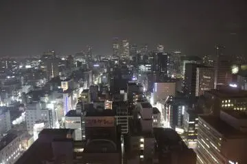 <p>Glimmering buildings twinkling at night</p>