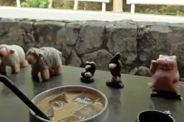 <p>Drinks are served in pottery that is sold in the store. The figurines are also for sale.</p>