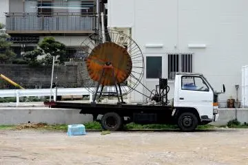<p>The big wheel on this truck is used to pull up large nets</p>