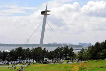 <p>A modern sculpture towers over the park</p>