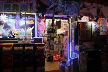 <p>The shops, like the buildings, come alive at night</p>