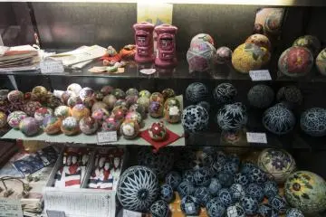 <p>The round balls here on display are called temari, literally 'handball'. I would imagine it used to be a sport, until the decorations became so intricate it is now more of an art form.</p>