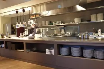 <p>Guests can see some of the delicious dishes being prepared in this open kitchen.</p>