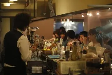 <p>Customers ordering at the bar.&nbsp;</p>