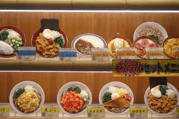 <p>Food samples in a shop window at night.&nbsp;</p>