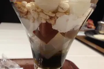<p>Hojicha roasted tea Ice cream parfait with glaced chestnuts, rice bubbles, glass jelly and dango rice dumplings.</p>