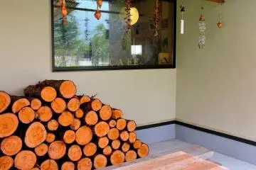 <p>Wood stacked outside the cafe</p>