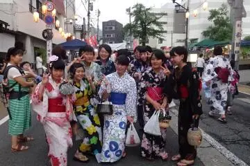 <p>Lovely young ladies wear their yukata and kimonos to the event.</p>