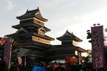 <p>Setting sun reflecting off Matsumoto Castle</p>