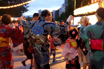 Three generation take part on Hokkai Bon Odori for children.