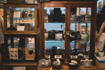 <p>Cabinet of perfect condition second hand cameras</p>