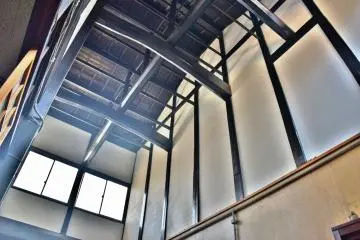 The restored kitchen with high ceilings, made possible with the assistance of the Machizukuri Fund.
