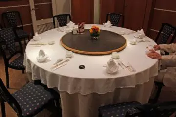 <p>The table in our private dining room. The lazy Susan turntable is fun and convenient &nbsp;</p>