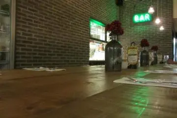 The bar is an open area where you can watch the kitchen staff as well as people watch