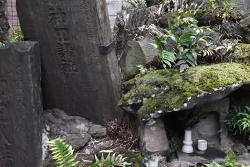 Weathered, moss-covered stones show the shrine's age