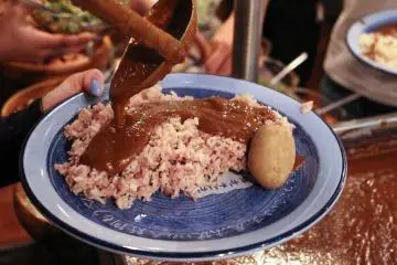 Serving their curry sauce