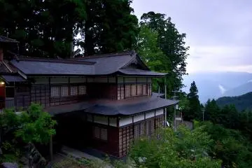 Fireworks are set off behind this building where donations are presented (nokyo)