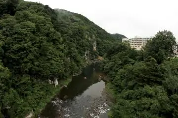 This is a view from the bridge. You can see the hotel in the right side of the frame and some adventurous people rafting on the river below.&nbsp;