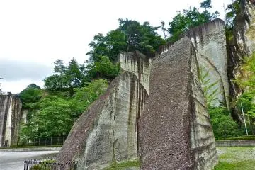 The statue was carved into the stone wall of an old quarry