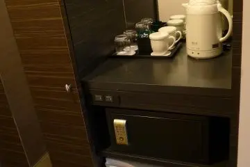 The pantry is located next to the wardrobe with a sliding door and mirror.