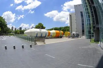 <p>Spacecraft on the outside of the building display the different sections of this specific model</p>