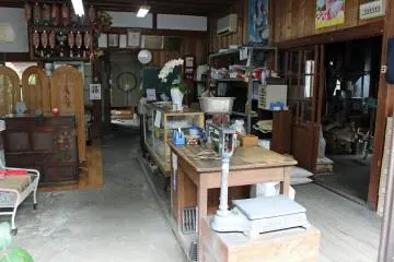 <p>A rice store with original furniture, scales and tools from days past</p>