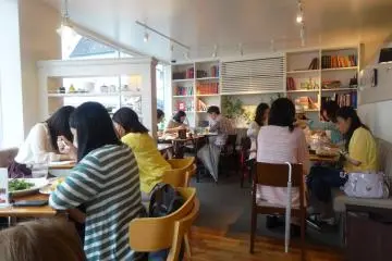 <p>The cafe is on the second floor and offers diners near the window a good view of the action below</p>