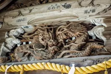 <p>A bigger and even scarier looking dragon can be seen higher up on the front roof</p>