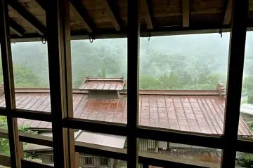 <p>The second floor overlooks the red iron roof of Osaka-ya Inn</p>