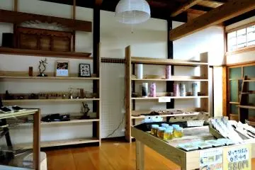 <p>A small shop sells local products like honey, hand made lamps and ink stones for calligraphy</p>