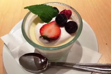 <p>A delicious selection of small desserts, including panna cotta topped with summer berries.</p>
